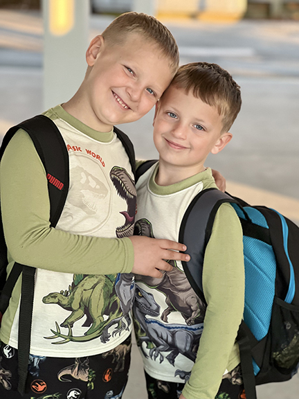Two happy children going to school